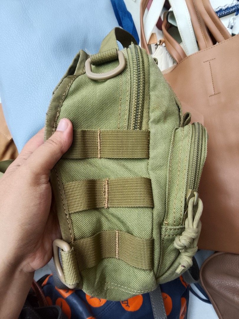 TACTICAL BAG (Category: Sling Bags) located in Naga. Submitted by choythrift (Listing ID 1467856029, Image 3). Description: For her/him 👧🏻🧒🏻 TACTICAL BAG 9/10 excellent condition 9/10 color rate Plus shipping fee Courier: J and t, flash express Drop off: Urban Chicc Location: Naga City, Bicol📍 📩.