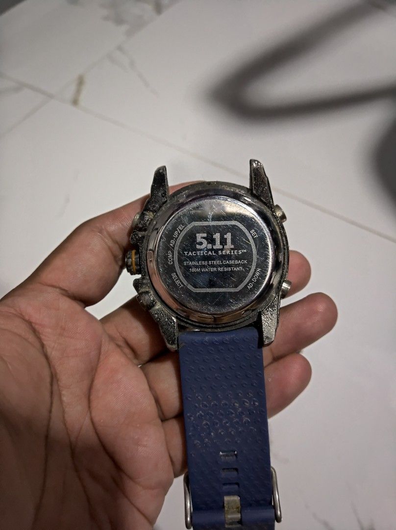 Tactical Men's Watch (Category: Men's Watches) located in General Trias. Submitted by mervcorner (Listing ID 1468054594, Image 2). Description: Men's Watch Brand: 5.11 Authentic Tactical Series Stainless Steel Caseback 100M Water Resistant Uses 2x battery for hand and digital na kapapalit palang. ISSUE: missing one side rubber strap BEST for outdoor activities. Been using this when biking in any rough weather condition actually. RFS: Decluttering