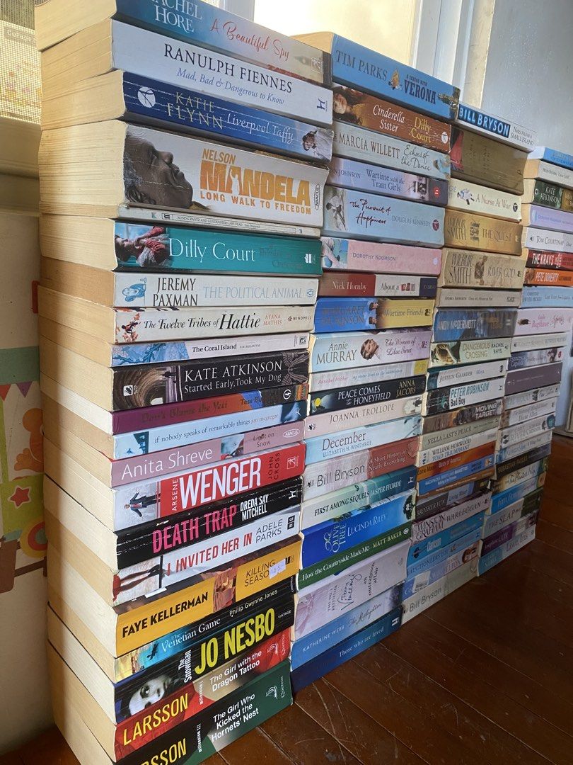 TAKE ALL (Category: Storybooks) located in Quezon City. Submitted by donagraceliwanag (Listing ID 1467881506, Image 2). Description: - Massive stack of fiction and non-fiction paperbacks - Featured authors: Bill Bryson, Nelson Mandela, Jo Nesbo, Stieg Larsson, and more - Genres: Thrillers, memoirs, contemporary novels, and more - Condition: Varies degrees of tanning and shelf wear, spines mostly intact - Available as a complete bundle or individu