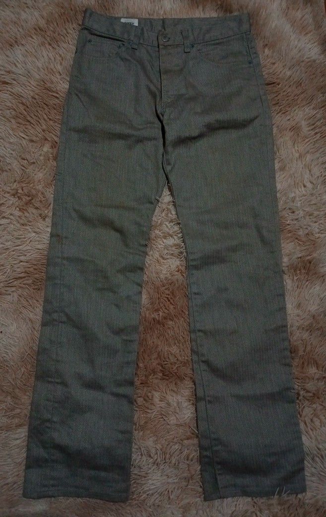 Takeo Kikuchi Herringbone Pattern Pants Size 2 (Category: Jeans) located in Boston. Submitted by johnpaulvi30029 (Listing ID 1467999151, Image 1). Description: Takeo Kikuchi gray trousers with a distinct herringbone weave pattern throughout. Size 2 on the inner waist label. Button fly closure, front pockets, and rear patch pockets. Straight leg cut. Clean interior lining with Japanese care tags. Neutral tone works easily with various tops..