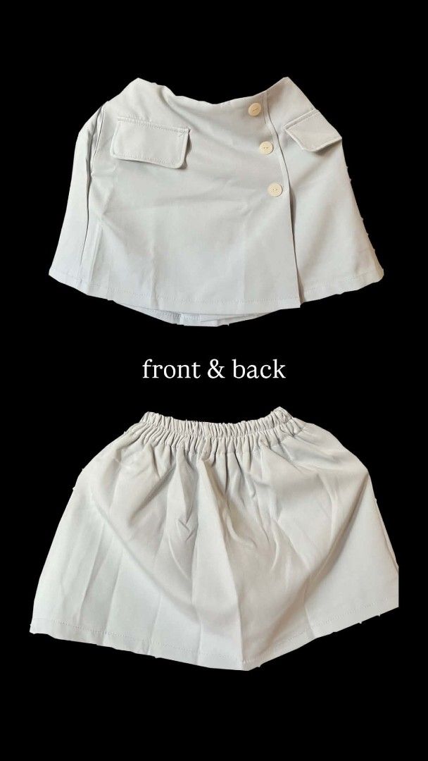 Talent / Prompt Skort (Category: Skirts) located in Marikina City. Submitted by savemyclosetph (Listing ID 1467945799, Image 2). Description: Set of three skorts in white, light blue, and black. Made in Thailand by Talent and Prompt. Free size with elastic waistband on the back. Front flap design with decorative buttons and pocket flaps. Pleated front look. Material is lightweight and smooth. Unworn condition with original tags attached. Size: Sm