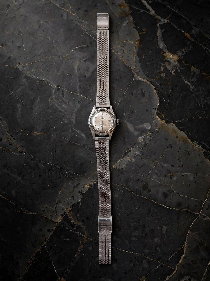 Technos Vintage Watch (Category: Women's Watches) located in Caloocan City. Submitted by chonadura91470 (Listing ID 1467916479, Image 1). Description: - Brand: technos vintage watch produce in the 60's and 70's - Movement: Automatic (winds smoothly) - Dial: Silver sunburst with fluted bezel - Date: 3 o'clock position with unique red numbers - Material: Stainless steel case with vintage mesh-style metal bracelet - Details: Sonnige stamped case bac