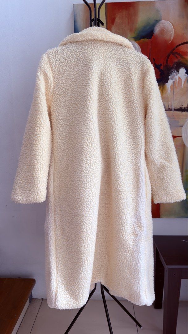 Teddy Bear Double-Breasted Long Coat (Category: Coats, Jackets and Outerwear) located in Manila. Submitted by shopaholic8008 (Listing ID 1467900194, Image 2). Description: - Brand/Model: EllyBazar Teddy Bear Coat - Color: Cream with contrast brown buttons - Size: XS can fit upto xl - Features: Double-breasted front, notch lapels, and fully lined interior - Material: Plush, fuzzy fleece inside and out for maximum warmth - Condition: Clean overall,