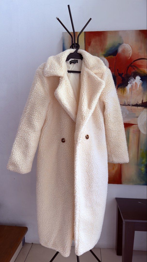 Teddy Bear Double-Breasted Long Coat (Category: Coats, Jackets and Outerwear) located in Manila. Submitted by shopaholic8008 (Listing ID 1467900194, Image 1). Description: - Brand/Model: EllyBazar Teddy Bear Coat - Color: Cream with contrast brown buttons - Size: XS can fit upto xl - Features: Double-breasted front, notch lapels, and fully lined interior - Material: Plush, fuzzy fleece inside and out for maximum warmth - Condition: Clean overall,
