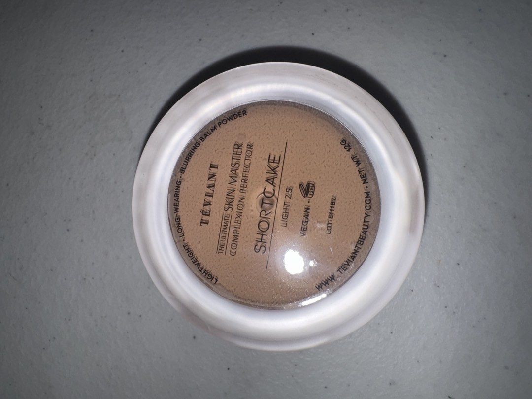 Teviant The Ultimate Skin Master-Shortcake (Category: Makeup) located in Cavite. Submitted by mimilovesimple (Listing ID 1468055322, Image 2). Description: - Brand: Teviant - Product: The Ultimate Skin Master Complexion Perfector - Shade: Shortcake (Light 225) - Size: 12g (Net weight) - Formula: Lightweight, long-wearing blurring balm powder, vegan - Packaging: Original container with mirror finish cap and built-in applicator handle - Condition: 