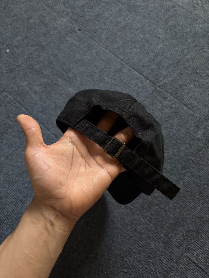 The hundreds dadhat (Category: Caps & Hats) located in Manila. Submitted by toys_hats005 (Listing ID 1467957902, Image 2). Description: - Color: Classic Black - Material: Comfortable 100% Cotton - Design: Minimalist graphic patch on the front - Fit: Fully adjustable strap with metal slider buckle - Comfort: Built-in interior sweatband and breathable eyelets - Style: Easy everyday streetwear accessory.