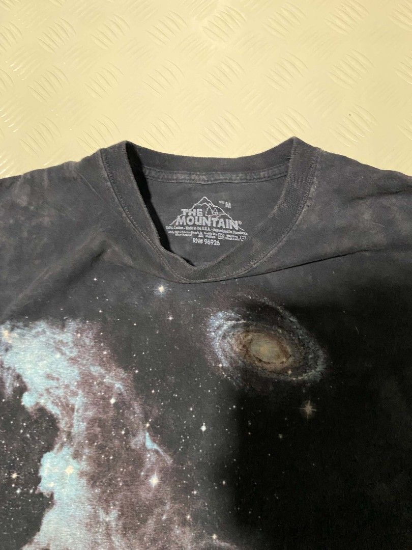 The Mountain Space Solar System T-Shirt Size M (Category: Tshirts & Polo Shirts ) located in Dipolog. Submitted by just_thriftfinds (Listing ID 1467846843, Image 3). Description: - Brand: The Mountain - Design: Solar system, planets, and galaxy graphic print - Artist/Copyright: Vincent Hie (Dated 2009 near hem) - Color/Pattern: Dark wash tie-dye - Size: Medium (Tag at collar) - Fit: Relaxed fit with regular short sleeves - Material: Comfortable 1