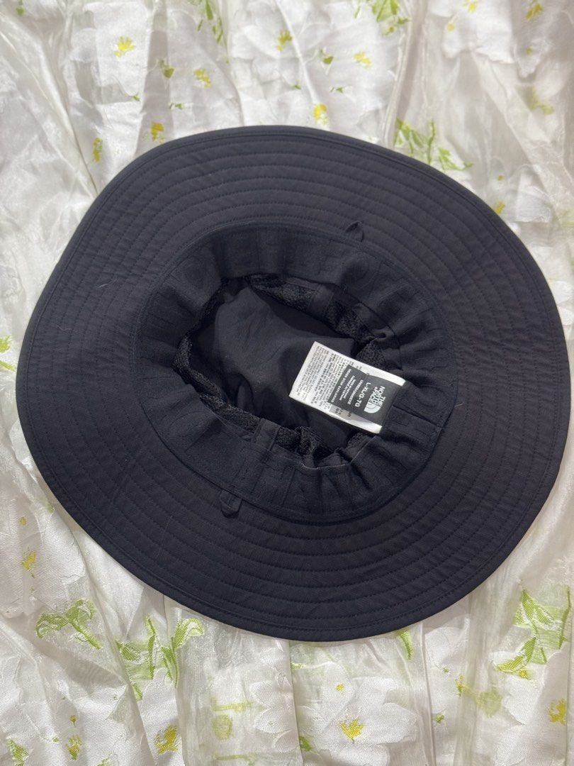 The North Face 100% Original (Category: Caps & Hats) located in Manila. Submitted by wildbear.e10374 (Listing ID 1467872097, Image 3). Description: - Brand: Authentic The North Face - Color: Black with white logo embroidery - Size: L-XL (Unisex fit) - Features: Wide brim style & adjustable chin strap - Origin: Made in Vietnam - Condition: Clean inside and out, excellent pre-loved condition this item is 100% Original..