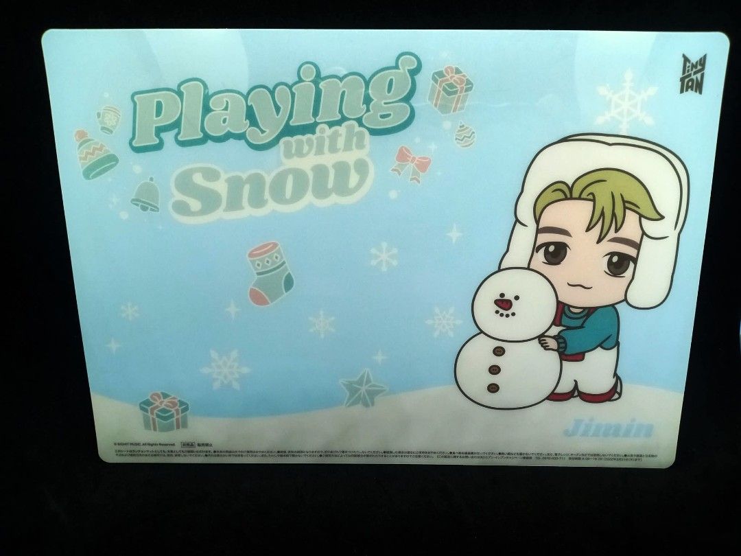 TinyTAN Jimin Playing with Snow pencil boad BTS (Category: K-Wave Merchandise) located in Pila. Submitted by Yela.ph_1 (Listing ID 1468025786, Image 1). Description: - Official TinyTAN merchandise featuring Jimin - Winter 'Playing with Snow' theme with Jimin and a cute snowman - Smooth plastic finish - Standard placemat and desk mat size - Perfect collectible for BTS ARMY.