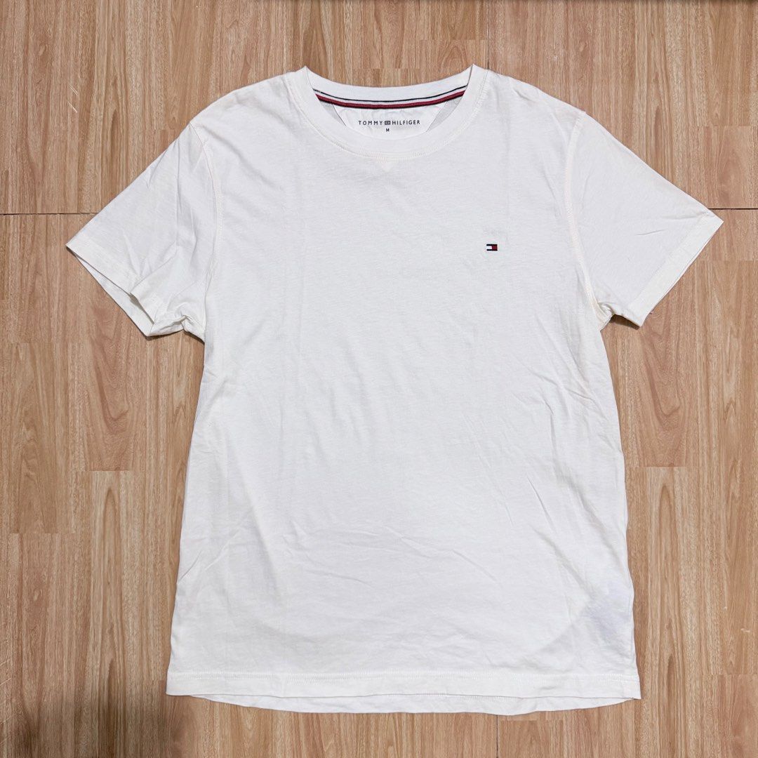 Tommy Hilfiger White T-Shirt (Category: Tshirts & Polo Shirts ) located in Angeles City. Submitted by gooddealsbytey (Listing ID 1468009359, Image 1). Description: Width: 18.5 | Length: 27.
