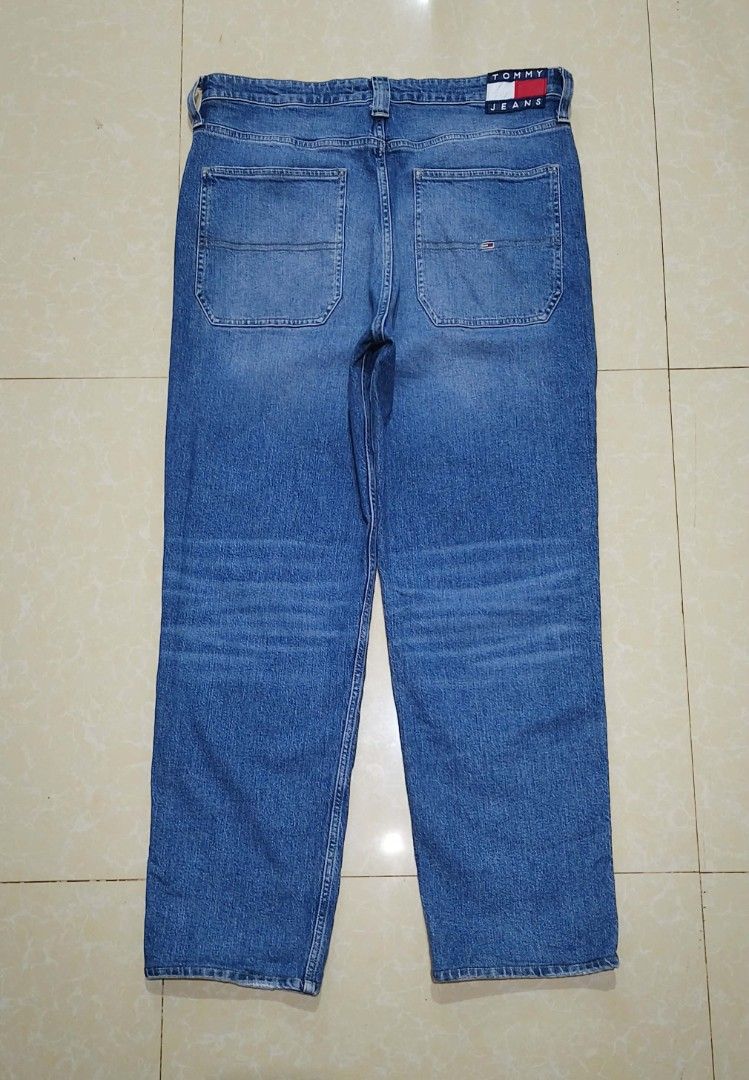 Tommy Jeans Blue Denim Pants (Category: Jeans) located in Manila. Submitted by purefire-477a (Listing ID 1467851467, Image 2). Description: - Brand: Tommy Jeans - Style: Classic straight leg denim pants - Color/Wash: Versatile medium blue wash with light fading - Details: Signature logo patch on back waistband, small flag branding on coin and back pockets - Features: Traditional five-pocket styling and button fly - Condition: Excellent quality, r