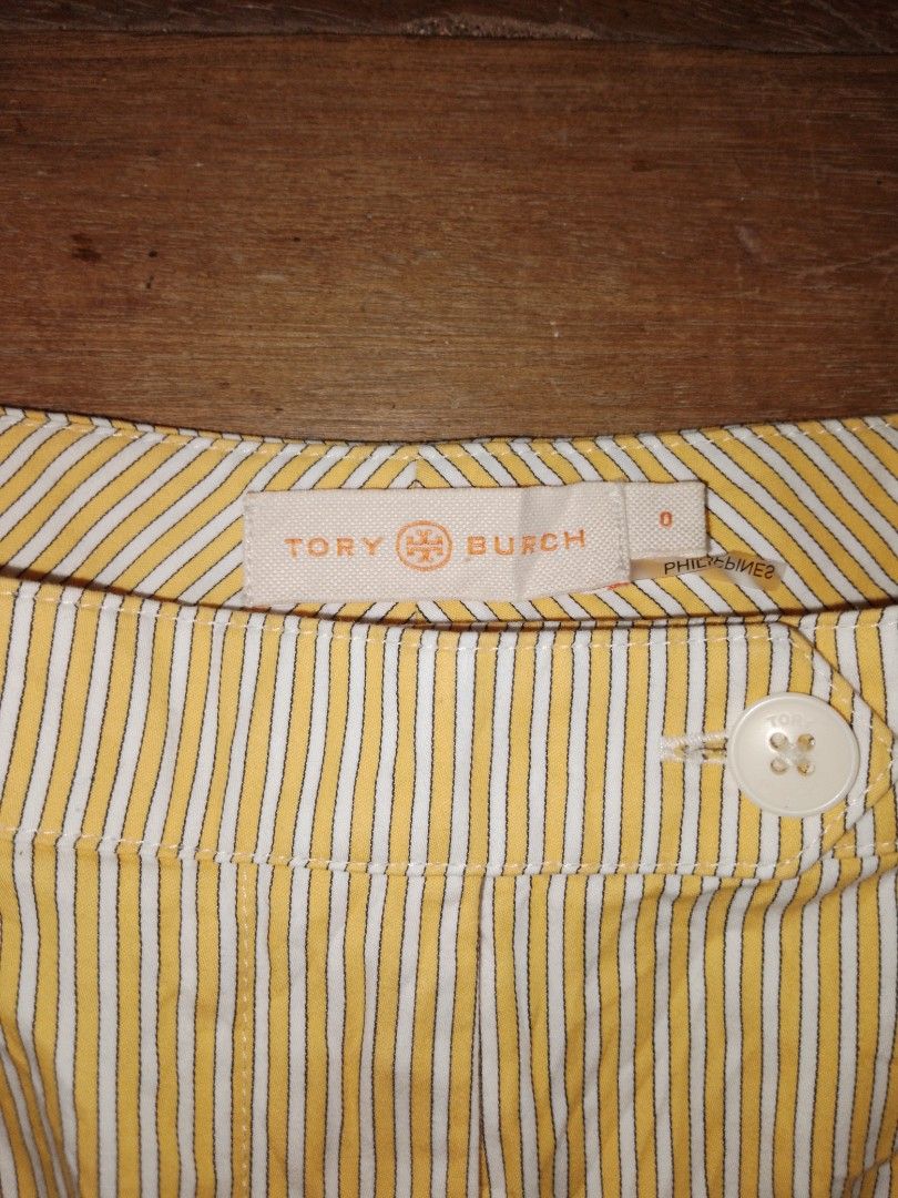 Tory Burch Yellow Pinstripe Shorts (Category: Shorts) located in Cagayan de Oro. Submitted by august.colms (Listing ID 1467901885, Image 2). Description: - Brand: Tory Burch - Size: 0 - Color: Yellow and white pinstripes - Material: 100% cotton - Design: Pleated front with white branded button closure - Care: Dry clean only - Origin: Made in the Philippines - Style: Casual summer wear with a great fit.