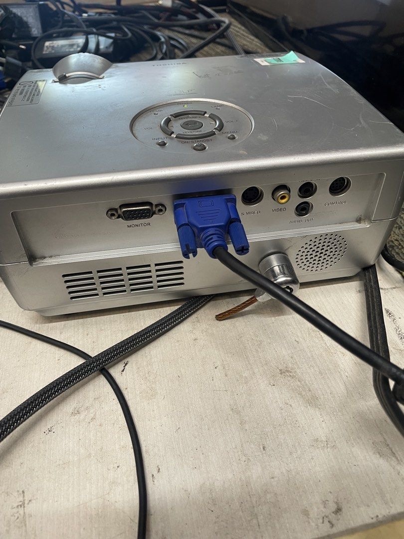 Toshiba TDP-T9 DLP Projector (Category: Projectors) located in Calamba. Submitted by jozamvibar76665 (Listing ID 1467861980, Image 3). Description: - Tested and working: Throws a bright, clear image perfect for movies and sports - Compact and portable design for easy setup anywhere - Condition: Normal cosmetic scuffs from past use, overall fully functional - Included accessories: Power cable, VGA cable, and attached lens cap - Connectivity: Monit