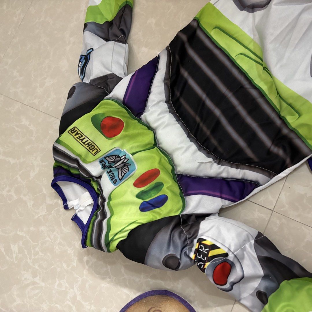Toy Story Buzz Lightyear Costume (Category: Babies & Kids Fashion) located in Makati City. Submitted by dianedelro (Listing ID 1467947903, Image 2). Description: - Toy Story Buzz Lightyear costume set - Full jumpsuit with printed control panel on chest and sleeves - Matching felt mask included - Separate printed belt with velcro attachment - Made from lightweight, comfortable fabric - Ideal for Halloween, birthdays, and dress-up parties.