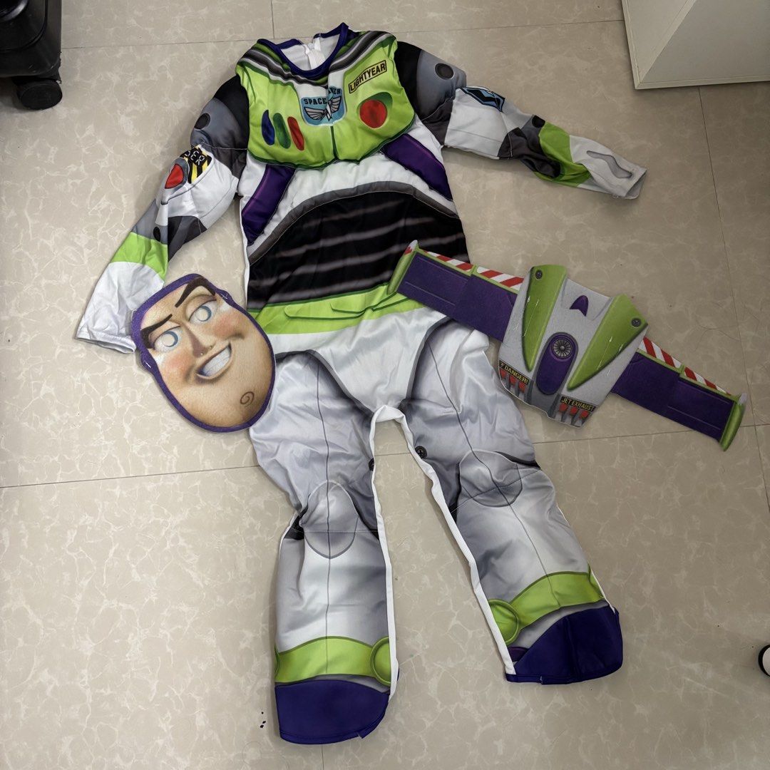 Toy Story Buzz Lightyear Costume (Category: Babies & Kids Fashion) located in Makati City. Submitted by dianedelro (Listing ID 1467947903, Image 1). Description: - Toy Story Buzz Lightyear costume set - Full jumpsuit with printed control panel on chest and sleeves - Matching felt mask included - Separate printed belt with velcro attachment - Made from lightweight, comfortable fabric - Ideal for Halloween, birthdays, and dress-up parties.