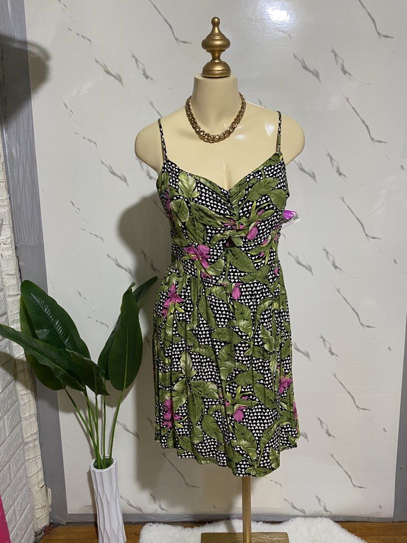 Tropical Leaf Print Spaghetti Strap Summer Dress (Category: Dresses) located in Taguig. Submitted by dinoswear.ph (Listing ID 1467855911, Image 1). Description: - Design: Green and black tropical leaf print with pink floral accents and geometric backdrop - Fit: Sweetheart neckline, adjustable spaghetti straps, and comfy smocked elastic back panel - Details: Front keyhole cutout and flattering ruched bust - Length: Flared knee-length skirt - Mater