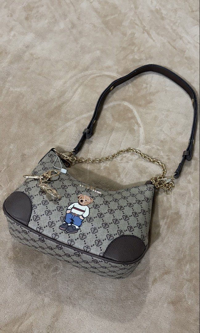 TTWN & Bear Brown Monogram Shoulder Bag with Teddy Bear Patch (Category: Shoulder Bags) located in Manila. Submitted by declutterwithesca (Listing ID 1468028641, Image 2). Description: - Bought in Malaysia - New.