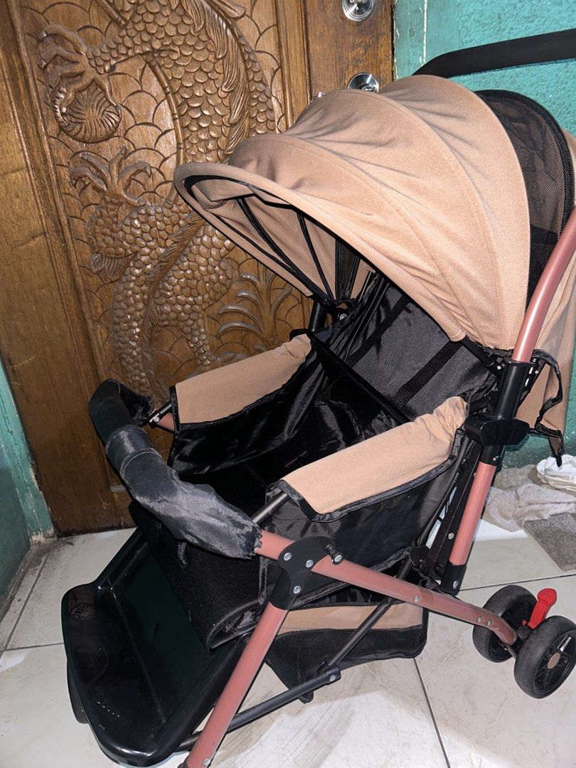 Two-way Baby stroller (Category: Strollers) located in Cavite. Submitted by ecustodio_19 (Listing ID 1468052537, Image 2). Description: - Sturdy pinkish frame with comfortable black handles - Adjustable canopy for excellent sun shade - Built-in safety harness straps for security - Includes a convenient footrest area at the bottom - Folds easily for hassle-free storage and transport - Clean fabric with only minor signs of handling.