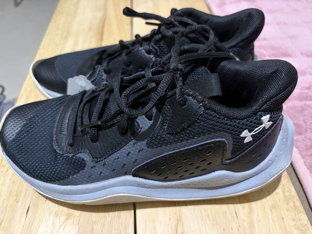 Under Armour Black Sneakers (Category: Sneakers) located in Paranaque City. Submitted by greatfinds108 (Listing ID 1467875448, Image 3). Description: - Brand/Model: Under Armour Athletic Shoes - Color: Black with grey midsole and white UA logo - Cushioning: Micro G midsole for comfort - Upper: Breathable mesh with lace-up closure - Details: Textured toe cap overlay - Condition: Minor separation visible at the front rubber sole boundary - Ideal fo