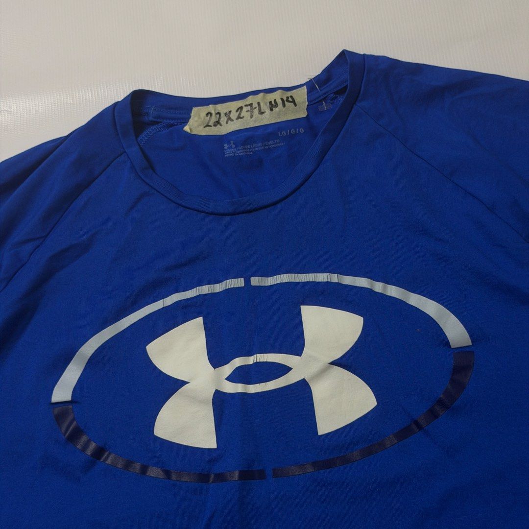 Under Armour Blue T-Shirt Large (Category: Tshirts & Polo Shirts ) located in Gapan. Submitted by rasthriftshop17 (Listing ID 1467994269, Image 2). Description: Size on tag: L Dimes: 22 x 27 Condition: Excellent Color rate: 9/10 Issue: hairlines.