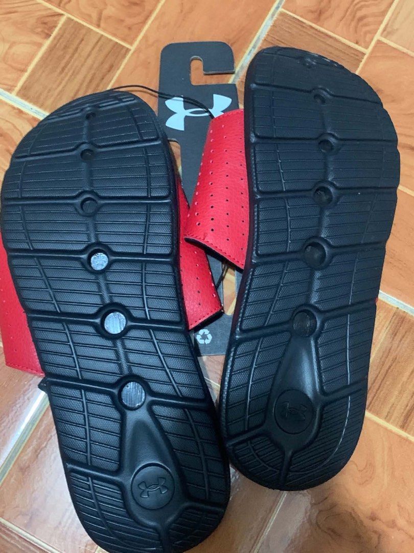 Under Armour Ignite Pro SL Red Black Slides US 10 (Category: Slippers & Slides) located in Las Pinas. Submitted by oddbear_162208 (Listing ID 1467852233, Image 2). Description: - Brand: Under Armour - Model: Ignite Pro SL Slides - Color: Red and Black - Size: US 10 / UK 9 / EUR 44 / CM 28 - Condition: Brand new with tags (BNWT) and original store hanger - Design: Adjustable top strap with large black logo - Comfort: Cushioned footbed with texture