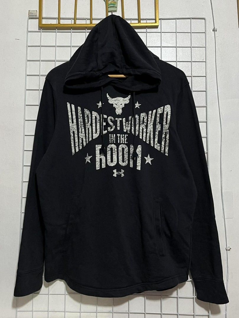 UNDER ARMOUR PROJECT ROCK TERRY HOODIE (Category: Coats, Jackets and Outerwear) located in Pagsanjan. Submitted by thriftyclothes33 (Listing ID 1467989034, Image 3). Description: 🔥 UNDER ARMOUR PROJECT ROCK TERRY HOODIE 💪 💰 PRICE: ₱750 + shipping fee 🏷️ Size: XL on tag 📏 Width: 23" | Length: 28.5" ✔️ “Hardest Worker in the Room” graphic 💪 ✔️ Signature Brahma Bull logo 🐂 ✔️ Lightweight French Terry fabric ✔️ Perfect for gym & casual wear 📦