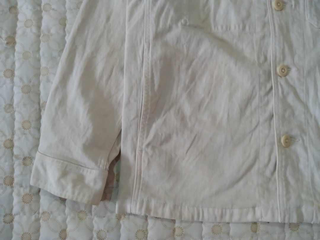 Uniqlo Beige Canvas Workwear Jacket (Category: Coats, Jackets and Outerwear) located in Zamboanga. Submitted by nurbya898048 (Listing ID 1468057666, Image 3). Description: Uniqlo canvas work jacket in off-white. Size M, made in Bangladesh. Classic utility style with front button closure, chest pocket, and side pockets. Durable cotton fabric layer. Clean design, easy to throw on over a t-shirt or hoodie for daily wear. Great transitional piece. Di
