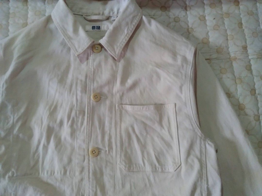 Uniqlo Beige Canvas Workwear Jacket (Category: Coats, Jackets and Outerwear) located in Zamboanga. Submitted by nurbya898048 (Listing ID 1468057666, Image 2). Description: Uniqlo canvas work jacket in off-white. Size M, made in Bangladesh. Classic utility style with front button closure, chest pocket, and side pockets. Durable cotton fabric layer. Clean design, easy to throw on over a t-shirt or hoodie for daily wear. Great transitional piece. Di