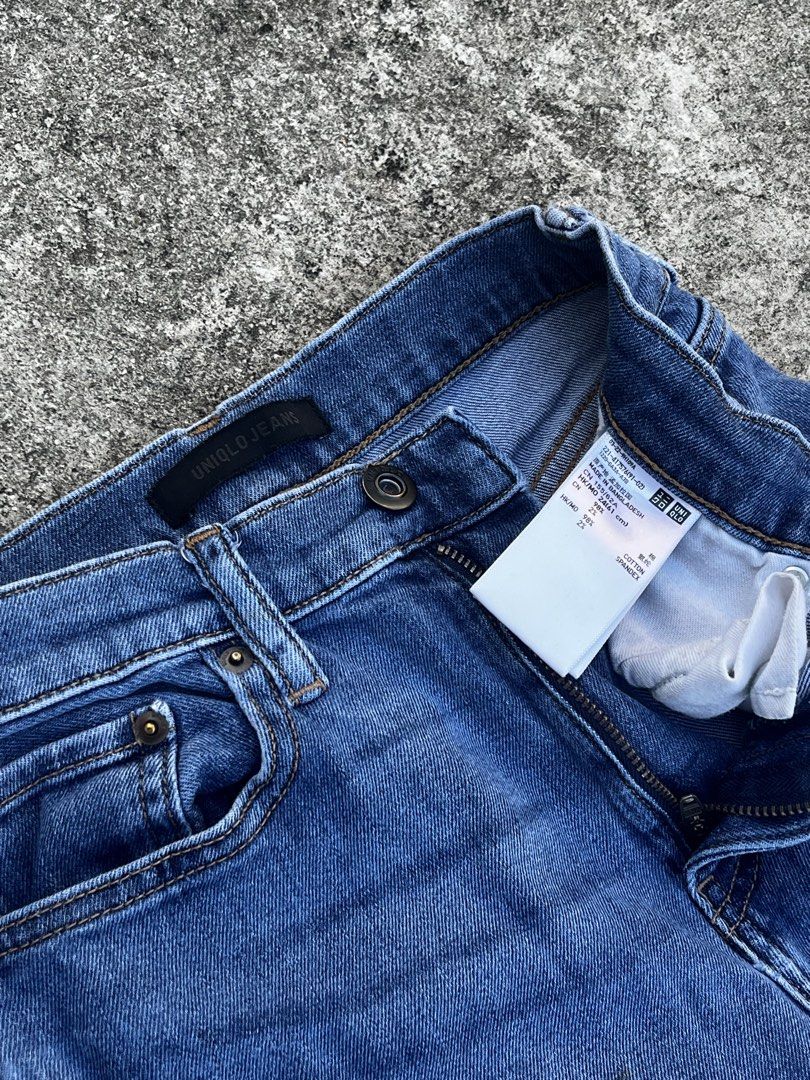 Uniqlo Jeans Distressed Blue Denim (Category: Jeans) located in San Fernando. Submitted by angelhave_wings (Listing ID 1468058434, Image 2). Description: - Brand: Uniqlo - Color: Classic mid blue wash - Fit: Mid-rise with standard belt loops - Material: Cotton and spandex blend for comfortable stretch - Details: Distressed knees with cool ripped spots - Style: Classic five-pocket design with zip fly - Condition: Well-maintained and ready to wear.