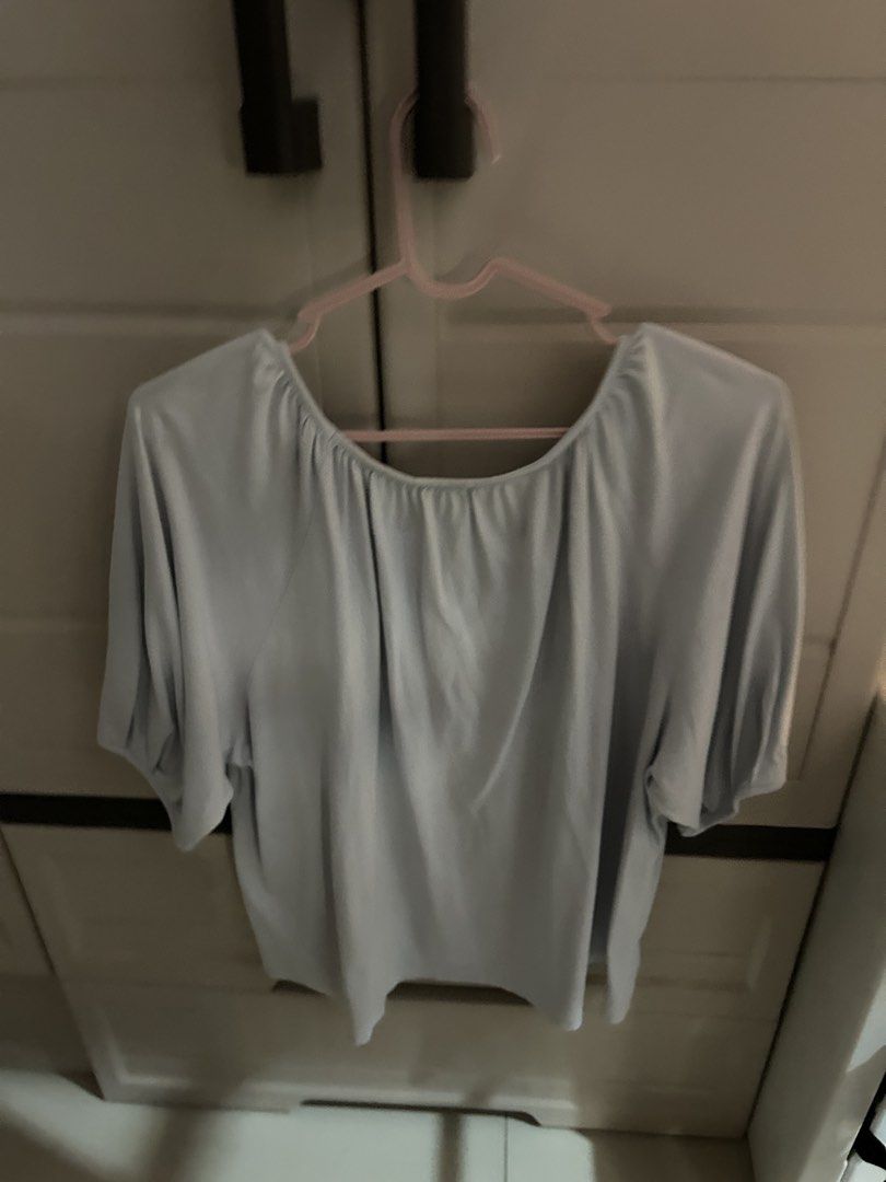 Uniqlo Light Blue Scoop Neck Blouse (Category: Blouses) located in Makati City. Submitted by sophcrates (Listing ID 1467984722, Image 2). Description: - Brand: Uniqlo - Color: Light Blue - Size: L (EU 40 / UK 12 / US 8) - Fit: Relaxed fit with a soft, comfortable drape - Neckline: Rounded scoop neck with stylish gathered details - Sleeves: Mid-length with gathered cuffs RFS: decluttering PM for more info last price indicated .