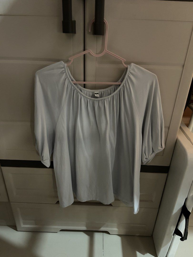 Uniqlo Light Blue Scoop Neck Blouse (Category: Blouses) located in Makati City. Submitted by sophcrates (Listing ID 1467984722, Image 1). Description: - Brand: Uniqlo - Color: Light Blue - Size: L (EU 40 / UK 12 / US 8) - Fit: Relaxed fit with a soft, comfortable drape - Neckline: Rounded scoop neck with stylish gathered details - Sleeves: Mid-length with gathered cuffs RFS: decluttering PM for more info last price indicated .