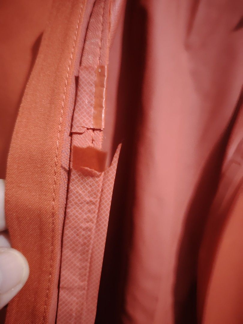 Uniqlo Parka Jacket (Category: Coats, Jackets and Outerwear) located in Taguig. Submitted by roniquefinds (Listing ID 1467862594, Image 3). Description: - Brand/Model: Uniqlo Hooded Jacket - Color: Vibrant Orange - Size: Medium (M) - Key Features: Water repellent, windproof, durable water repellent (DWR), and stretch fabric - Design: Zip front closure, attached hood, adjustable velcro sleeve cuffs - Flaw Notice: Inner seam taping has cracking and