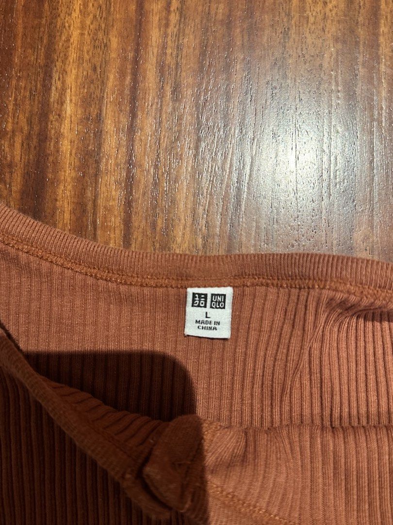 Uniqlo Ribbed Button-Front Tank Top (Category: Sleeveless) located in San Juan City. Submitted by gj10_ (Listing ID 1467992092, Image 2). Description: • as good as new • pm for more details .