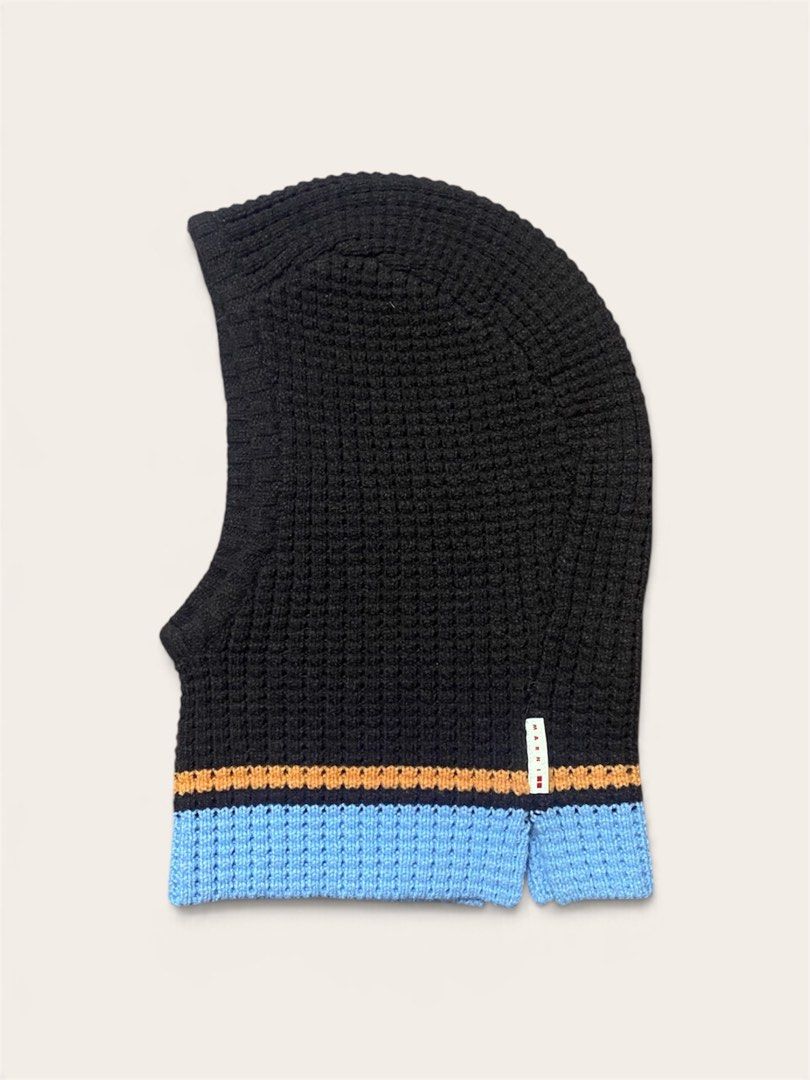 UNIQLO x MARNI Popcorn Knitted Balaclava (Category: Beanies) located in Naga. Submitted by dailyshipped (Listing ID 1468031380, Image 1). Description: • Material & Texture: Crafted with a textured waffle/popcorn knit stitch that provides excellent insulation and stretch. • Design Features: It features a rich dark brown base contrasted by sharp orange and sky-blue horizontal striped bands along the hem. A signature tiny woven Marni tag is attached