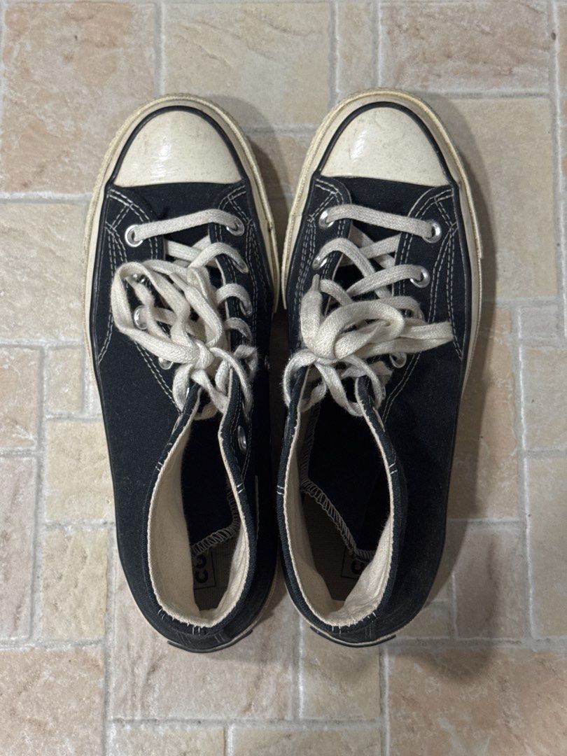 Unisex Converse Chuck 70 High Top Black (Category: Sneakers) located in Marikina City. Submitted by kbarellano (Listing ID 1467967308, Image 1). Description: - Classic black Converse Chuck 70 high tops - Iconic All Star ankle patches on the inner sides - Vintage-style rubber midsole with black piping and contrast stitching - Brown rubber outsoles with great traction - Standard lace-up closure with durable metal eyelets - Condition: Regular wear o