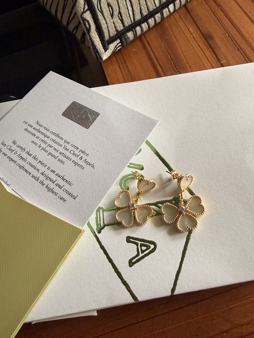 Van Cleef & Arpels Lucky Alhambra Earrings (Category: Earrings) located in Las Pinas. Submitted by twiceloved24 (Listing ID 1467891906, Image 1). Description: - Brand: Van Cleef & Arpels - Model: Lucky Alhambra Heart-Shaped Dangling Earrings - Authenticity: Includes certificate card and branded packaging envelope - Details: Clearly visible stamped hardware on the post - Condition: Great statement jewelry piece, well-maintained.