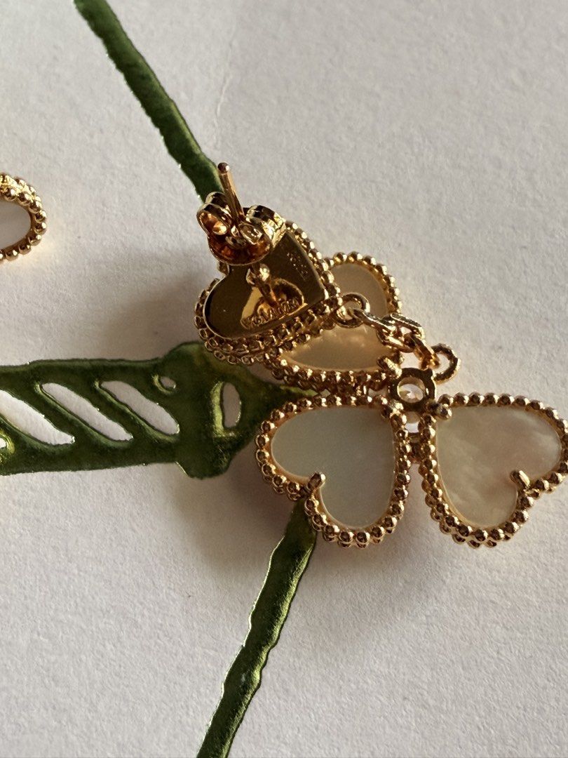 Van Cleef & Arpels Lucky Alhambra Earrings (Category: Earrings) located in Las Pinas. Submitted by twiceloved24 (Listing ID 1467891906, Image 3). Description: - Brand: Van Cleef & Arpels - Model: Lucky Alhambra Heart-Shaped Dangling Earrings - Authenticity: Includes certificate card and branded packaging envelope - Details: Clearly visible stamped hardware on the post - Condition: Great statement jewelry piece, well-maintained.