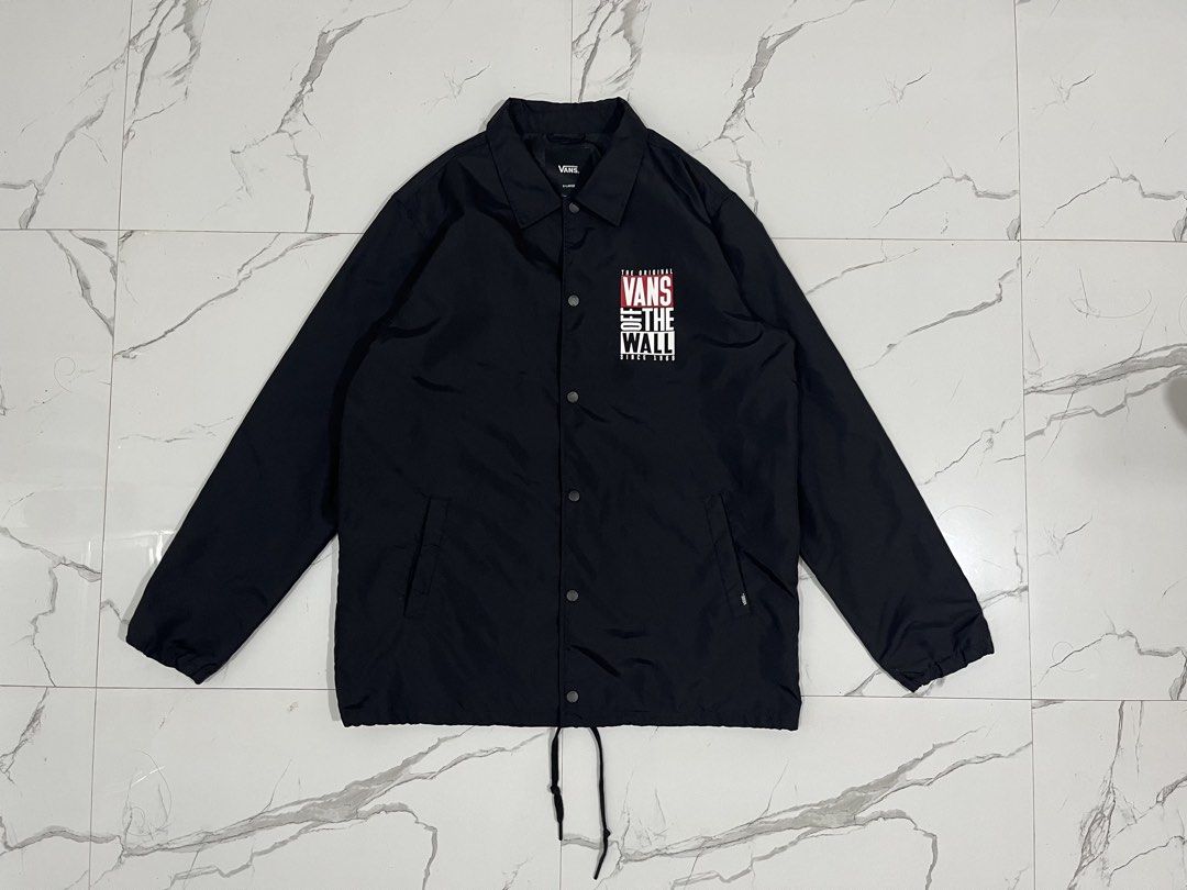 Vans Off The Wall Black Coach Jacket X-Large (Category: Coats, Jackets and Outerwear) located in Manila. Submitted by obedmagall74424 (Listing ID 1467874747, Image 1). Description: - Brand: Vans Off The Wall - Style: Black coach jacket - Size: Extra Large (XL) Dimensions 30.5x24 - Material: Lightweight nylon - Features: Snap button closure, collar neckline, two side pockets with small logo tags - Design: Small chest print and large graphic print 