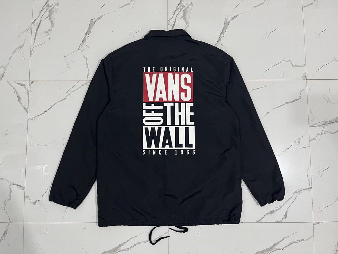 Vans Off The Wall Black Coach Jacket X-Large (Category: Coats, Jackets and Outerwear) located in Manila. Submitted by obedmagall74424 (Listing ID 1467874747, Image 2). Description: - Brand: Vans Off The Wall - Style: Black coach jacket - Size: Extra Large (XL) Dimensions 30.5x24 - Material: Lightweight nylon - Features: Snap button closure, collar neckline, two side pockets with small logo tags - Design: Small chest print and large graphic print 