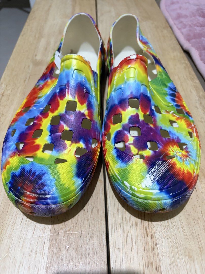 Vans Tie-Dye Slip-On Surf Shoes (Category: Sneakers) located in Paranaque City. Submitted by greatfinds108 (Listing ID 1467873836, Image 2). Description: - Brand: Vans (Slip-on surf shoes) - Condition: Brand new with price tag attached - Design: Vibrant all-over tie-dye pattern - Comfort: Perforated cutouts for breathability and white interior lining - Best for: Easy casual wear, summer, and beach days For pick up only.