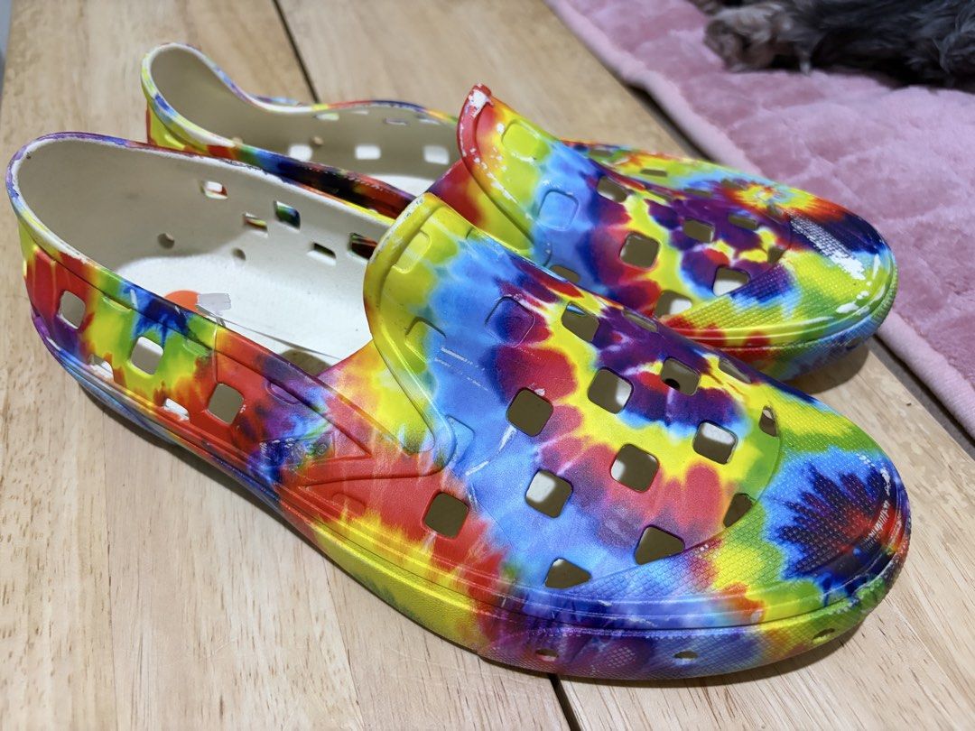 Vans Tie-Dye Slip-On Surf Shoes (Category: Sneakers) located in Paranaque City. Submitted by greatfinds108 (Listing ID 1467873836, Image 1). Description: - Brand: Vans (Slip-on surf shoes) - Condition: Brand new with price tag attached - Design: Vibrant all-over tie-dye pattern - Comfort: Perforated cutouts for breathability and white interior lining - Best for: Easy casual wear, summer, and beach days For pick up only.