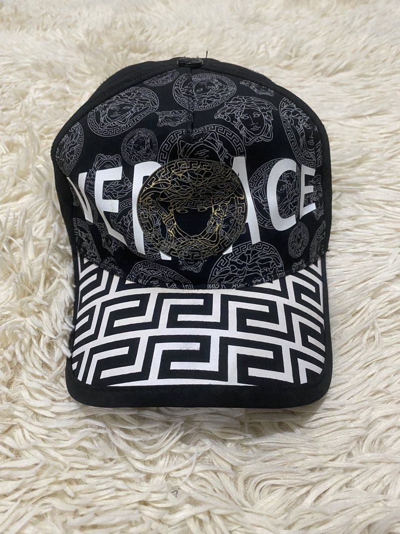 Versace Black and White Medusa Cap (Category: Caps & Hats) located in Manila. Submitted by switchcity (Listing ID 1467878184, Image 1). Description: - Brand new Versace baseball cap in sleek black and white - Features the iconic metal Medusa logo on the front and top button - Stylish Greek key pattern detail across the brim and strap - Adjustable metal buckle closure for a custom, comfortable fit - Premium quality and a bold statement piece for a