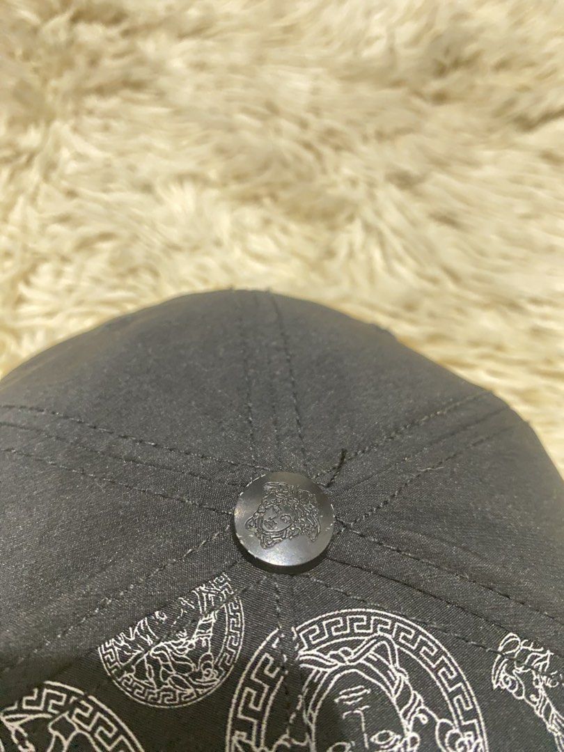 Versace Black and White Medusa Cap (Category: Caps & Hats) located in Manila. Submitted by switchcity (Listing ID 1467878184, Image 3). Description: - Brand new Versace baseball cap in sleek black and white - Features the iconic metal Medusa logo on the front and top button - Stylish Greek key pattern detail across the brim and strap - Adjustable metal buckle closure for a custom, comfortable fit - Premium quality and a bold statement piece for a