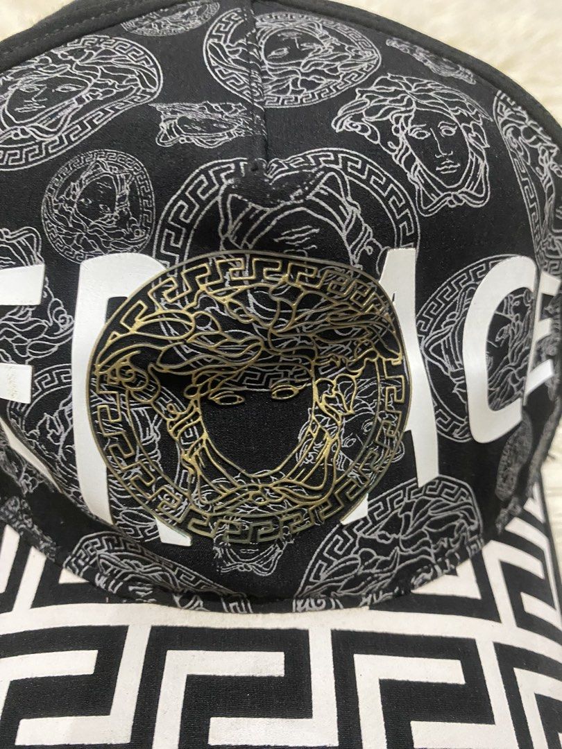 Versace Black and White Medusa Cap (Category: Caps & Hats) located in Manila. Submitted by switchcity (Listing ID 1467878184, Image 2). Description: - Brand new Versace baseball cap in sleek black and white - Features the iconic metal Medusa logo on the front and top button - Stylish Greek key pattern detail across the brim and strap - Adjustable metal buckle closure for a custom, comfortable fit - Premium quality and a bold statement piece for a