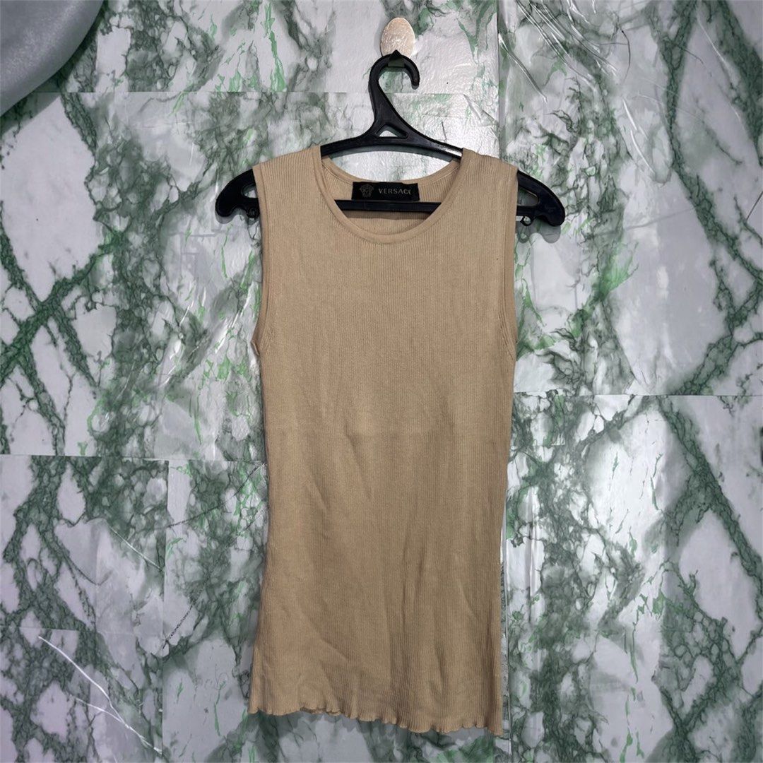 VERSACE knitted top (Category: Luxury Apparel) located in Bulacan. Submitted by letsfindukaywithme (Listing ID 1468051329, Image 1). Description: Versace Knitted top Size 40 Best fit small-medium Knitted strechable 11x23" Like new No issue +sf payment first Ship via J&T .