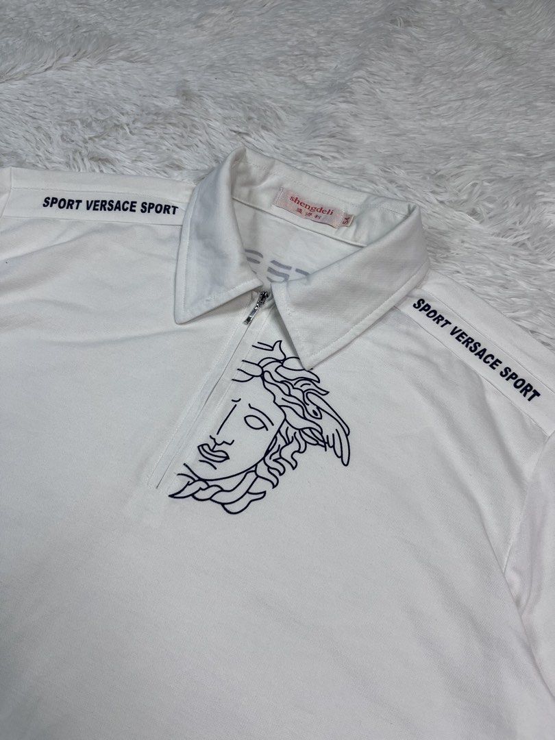 VERSACE POLO Q-ZIP (Category: Tshirts & Polo Shirts ) located in Manila. Submitted by bagayanagi11491 (Listing ID 1467901629, Image 2). Description: Excellent Condition Size: L-XL Dimes: 23x28 Issue: None The best to pang alis.