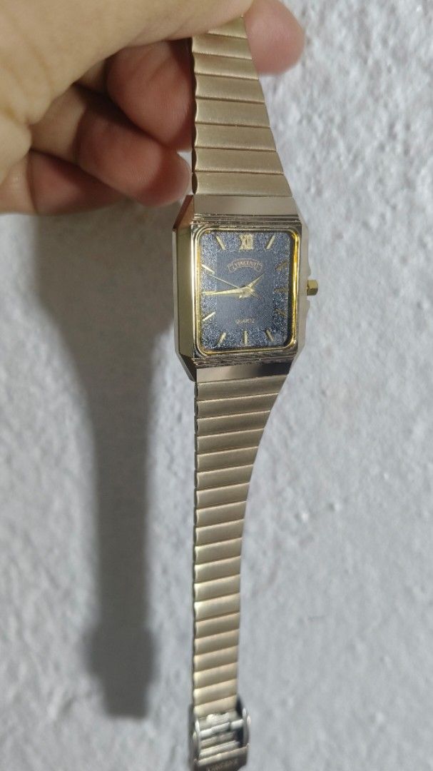 Vincent Gold Quartz Square Watch (Category: Women's Watches) located in Taguig. Submitted by mercyeugen28914 (Listing ID 1467886830, Image 2). Description: - Brand/Style: Vintage Vincent quartz watch with a classic design - Case & Strap: Gold-tone square case with a matching flexible link bracelet - Dial: Dark starry night dial accented with gold hands and a Roman numeral at twelve - Condition: Works well and keeps accurate time - Usability: Easy