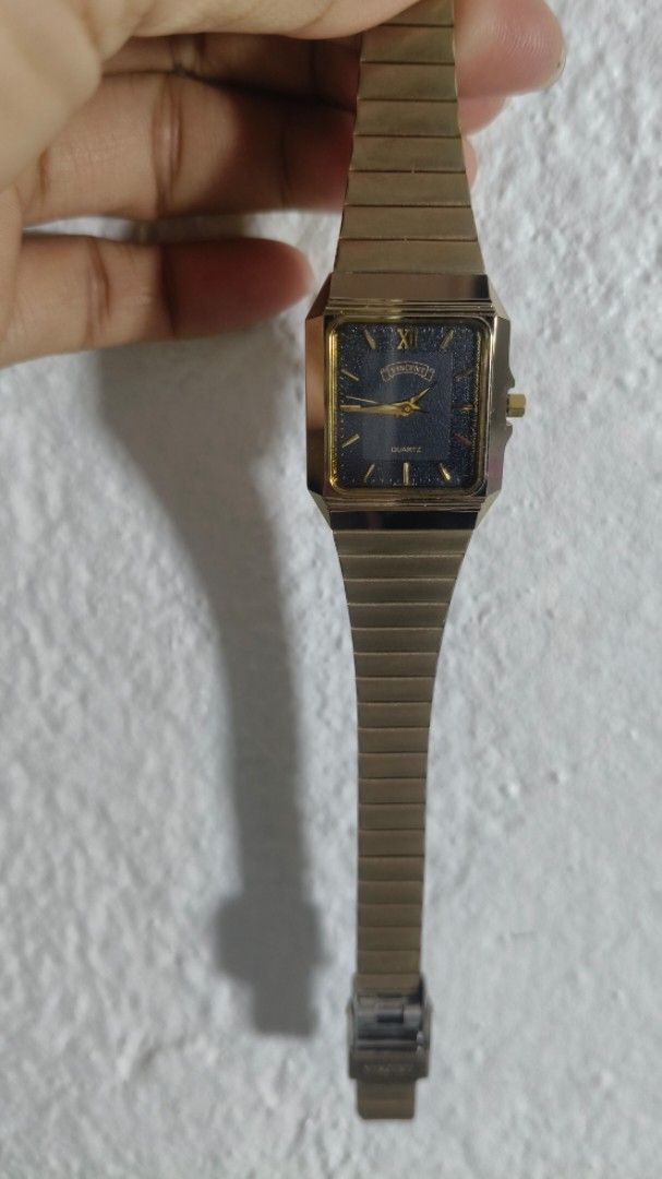 Vincent Gold Quartz Square Watch (Category: Women's Watches) located in Taguig. Submitted by mercyeugen28914 (Listing ID 1467886830, Image 3). Description: - Brand/Style: Vintage Vincent quartz watch with a classic design - Case & Strap: Gold-tone square case with a matching flexible link bracelet - Dial: Dark starry night dial accented with gold hands and a Roman numeral at twelve - Condition: Works well and keeps accurate time - Usability: Easy