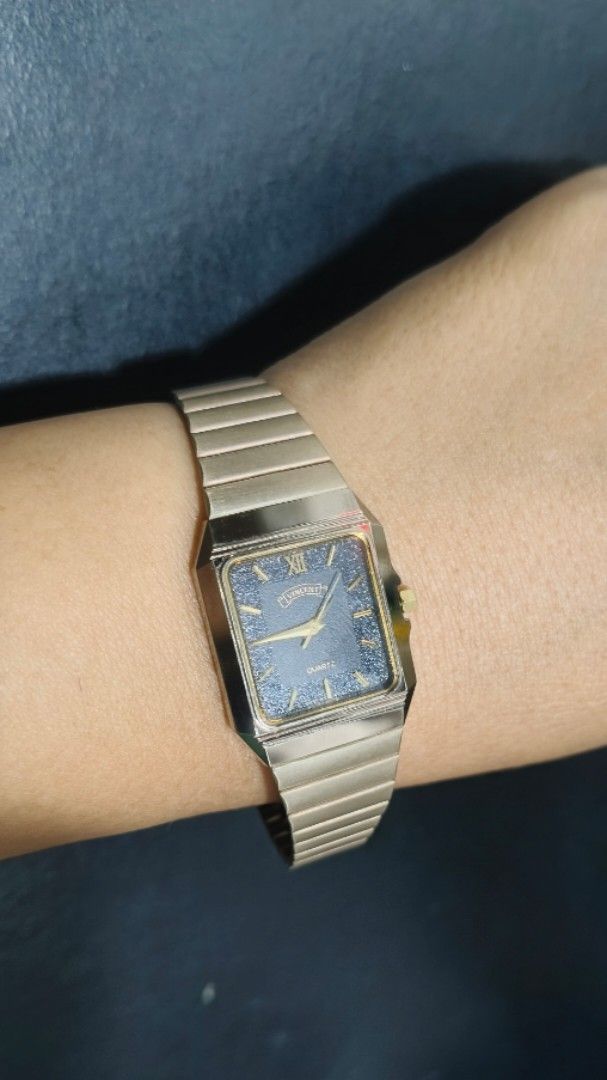 Vincent Gold Quartz Square Watch (Category: Women's Watches) located in Taguig. Submitted by mercyeugen28914 (Listing ID 1467886830, Image 1). Description: - Brand/Style: Vintage Vincent quartz watch with a classic design - Case & Strap: Gold-tone square case with a matching flexible link bracelet - Dial: Dark starry night dial accented with gold hands and a Roman numeral at twelve - Condition: Works well and keeps accurate time - Usability: Easy