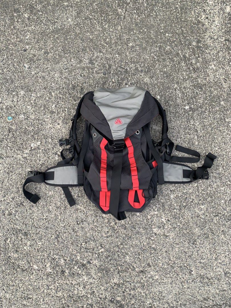Vintage 90’s Nike ACG Backpack (Category: Backpacks) located in Cebu City. Submitted by ninyothrift (Listing ID 1467925786, Image 1). Description: - Authentic Nike ACG backpack in a stylish black, grey, and red colorway - Durable ripstop grid pattern on the main body - Embroidered ACG logo on the top flap - Multiple adjustable straps and sturdy buckles for a secure fit - Padded mesh back panel for extra comfort and support - Functional compartmen
